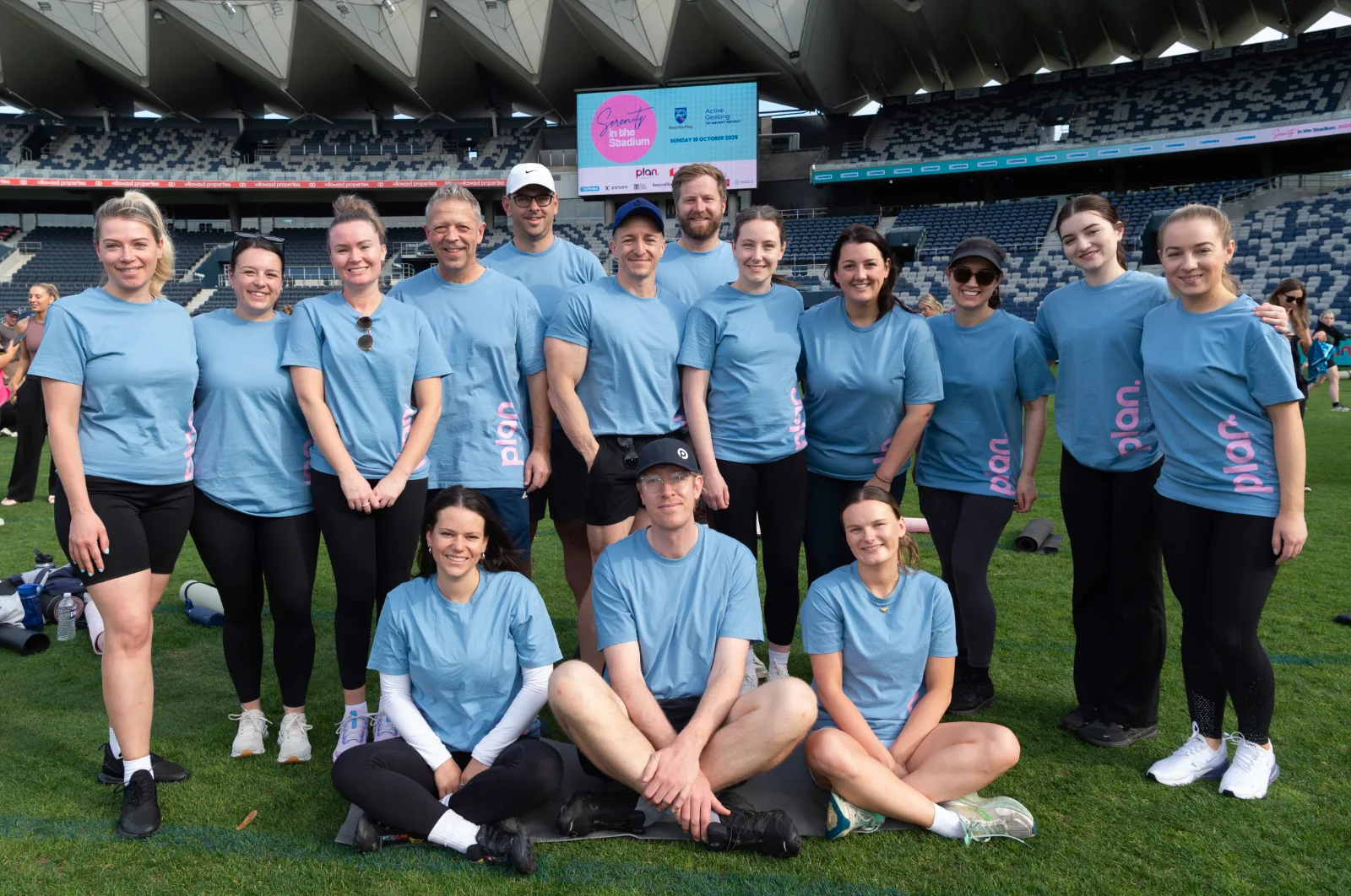 A workplace team together on the field
